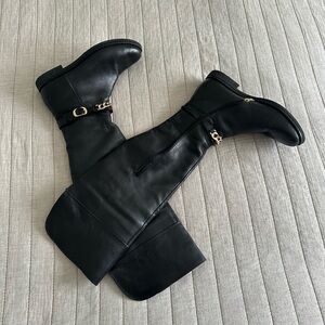 High boots. Black leather. Size 10.